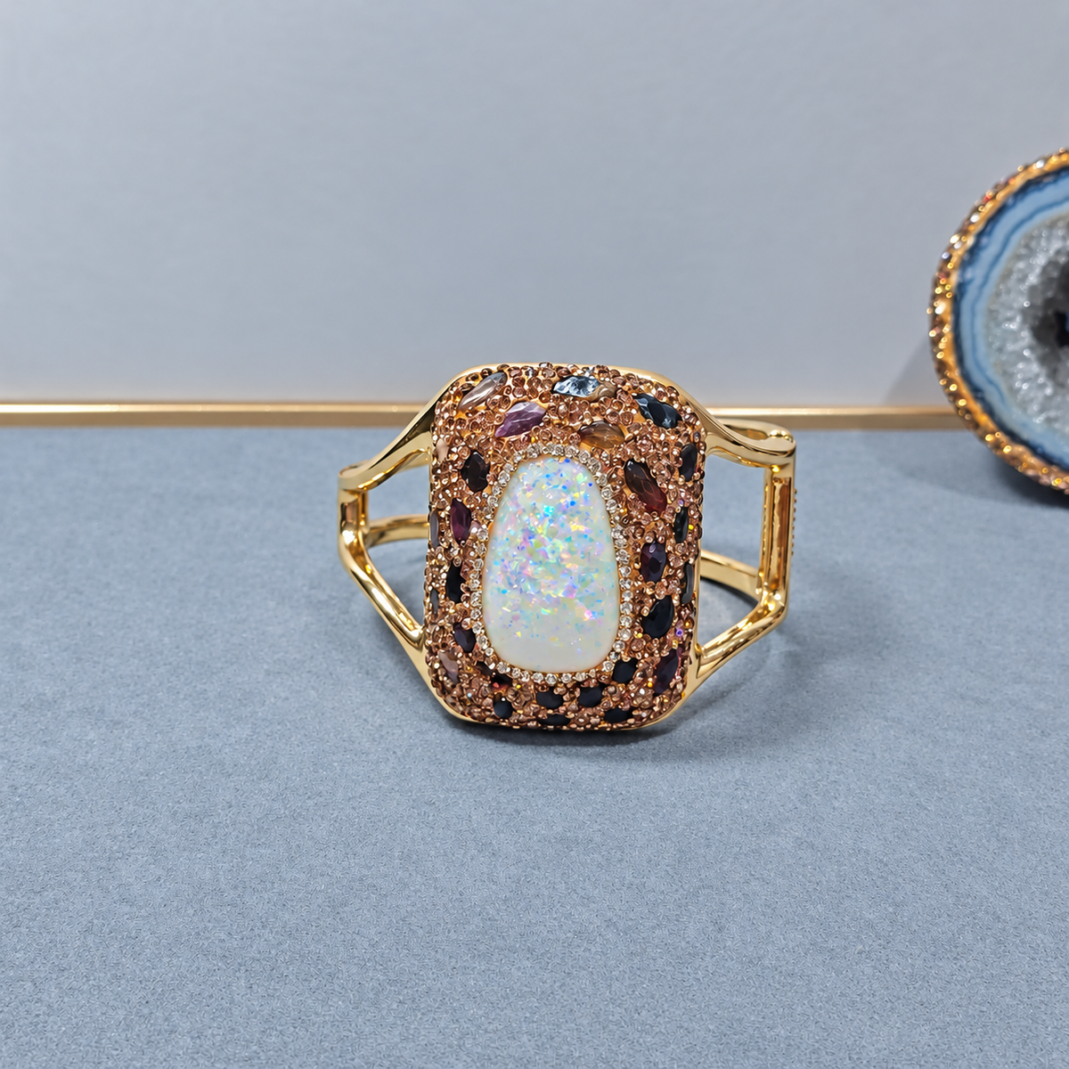 Bangle adorned with natural crystals and full rhinestones, sparkling statement piece
